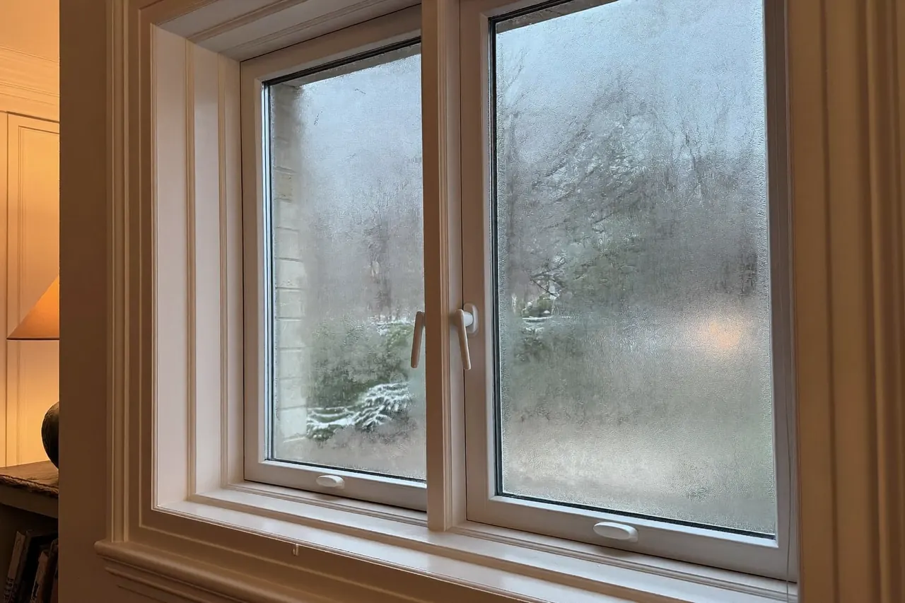 Detail of an energy-efficient double-glazed window keeping warmth inside a home