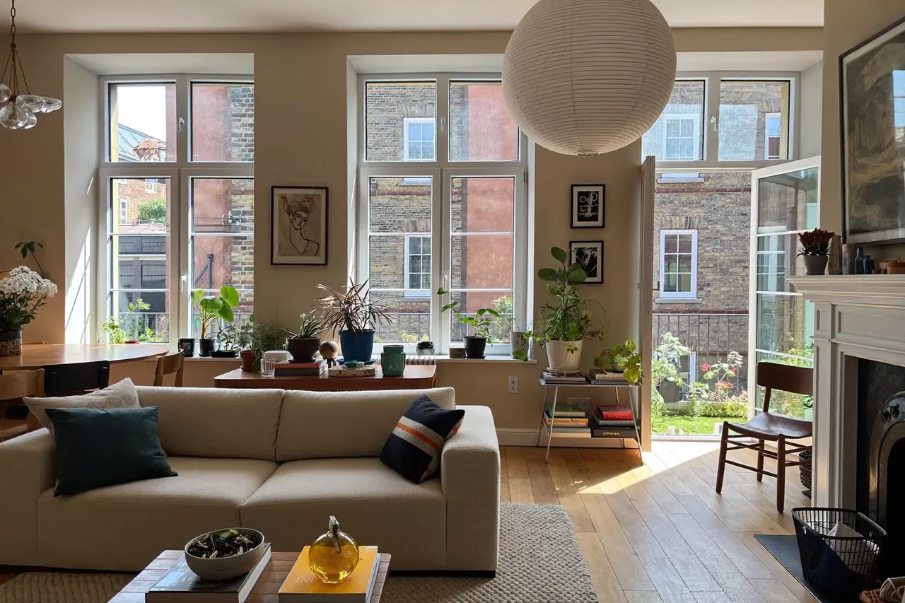 Warm living room with large new energy-efficient windows letting in daylight